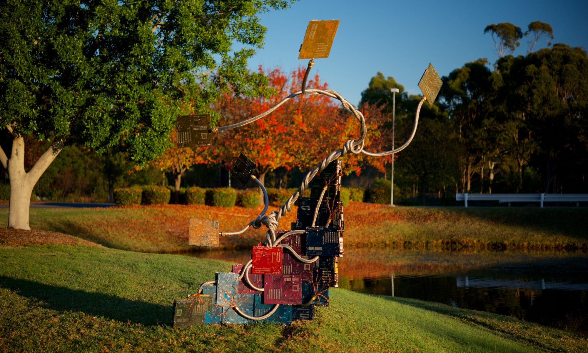 A large sculpture of a bonsai tree made from eWaste